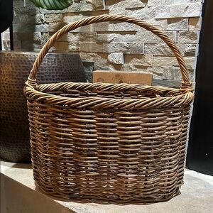 handwoven wicker basket with a single handle